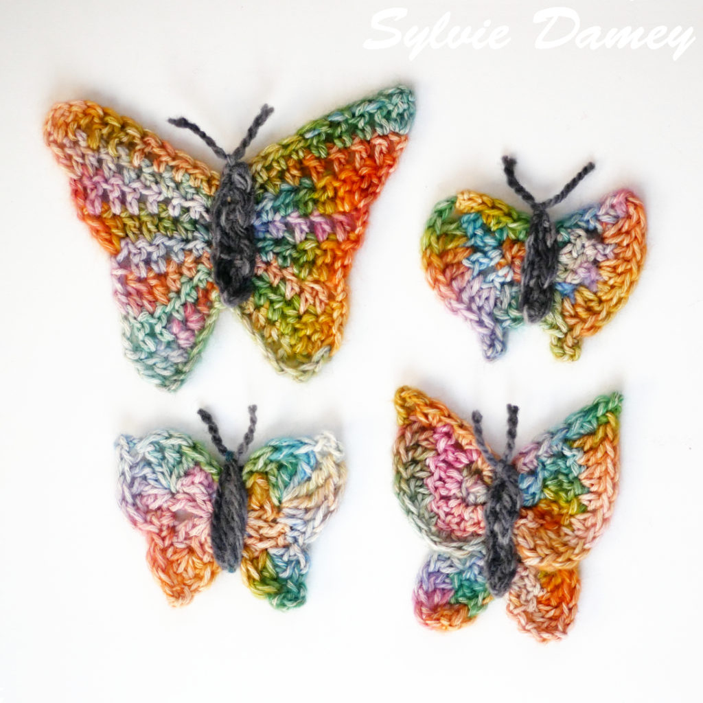 4 crocheted butterflies in rainbow colors, a crochet pattern by Sylvie Damey - 4 papillons au crochet colorés, modèles de Sylvie Damey